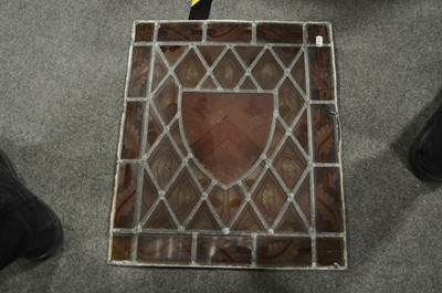 Lot 85 - A leaded and stained glass armorial panel, and five other panels