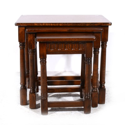 Lot 341 - A nest of three oak tables