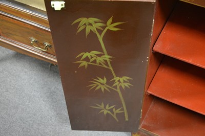 Lot 25 - A Chinese brown lacquered side cabinet