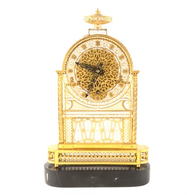 Lot 234 - A French pierced brass and gilt metal mantel clock