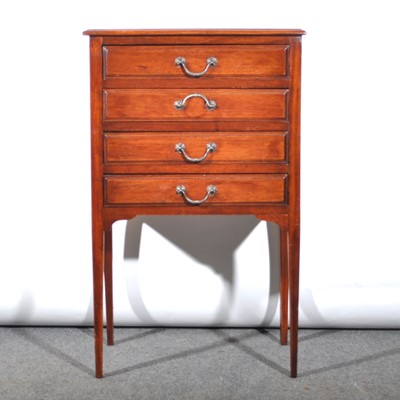 Lot 592 - A stained walnut music cabinet