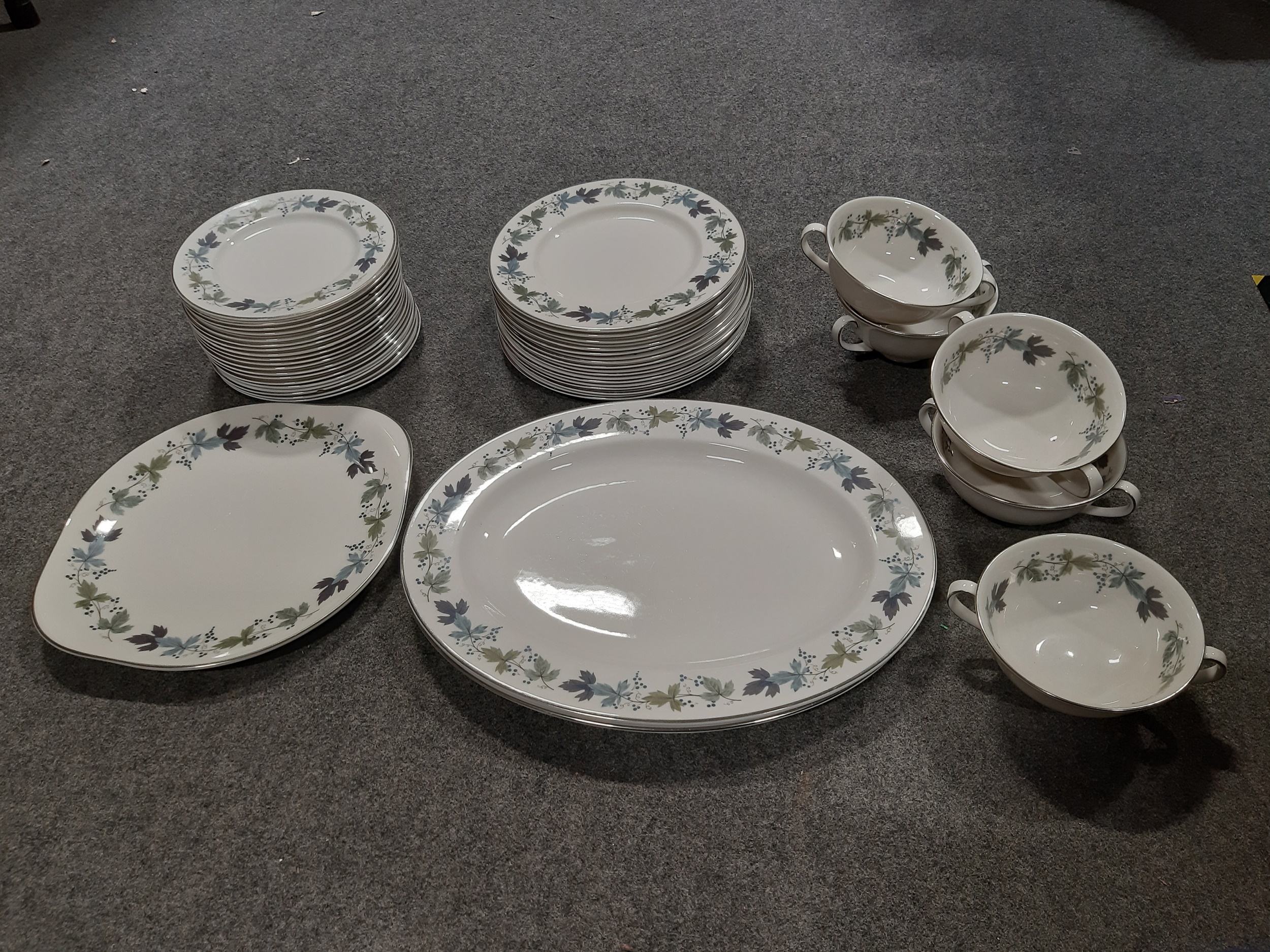 Lot 93 - A Royal Doulton china dinner service,