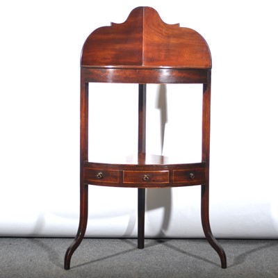 Lot 612 - George III mahogany corner washstand