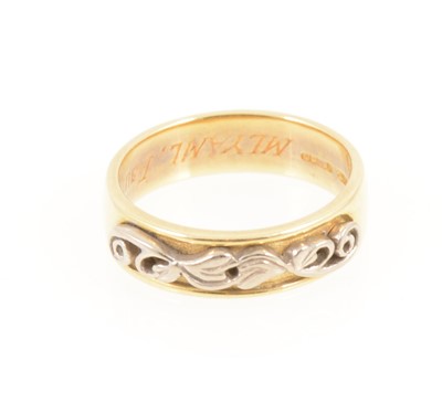 Lot 1283 - An 18 carat yellow and white gold friendship ring.