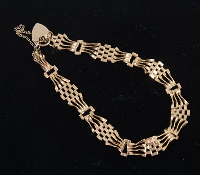 Lot 1311 - A 9 carat yellow gold gate link bracelet.