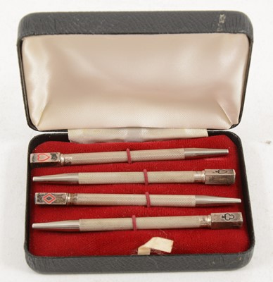 Lot 1216 - A cased set of silver bridge pencils.