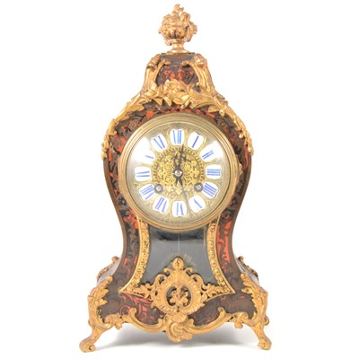 Lot 113 - A French Boulle-effect balloon shape mantel clock