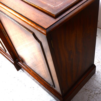Lot 120 - A reproduction mahogany breakfront bookcase, George III style