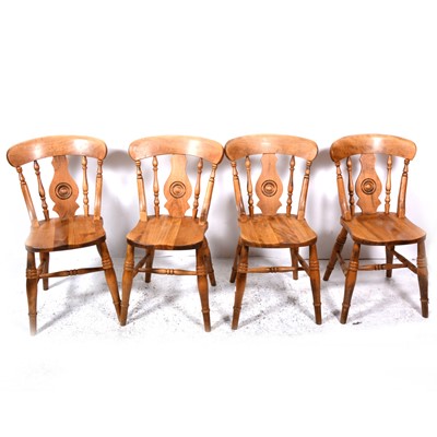 Lot 116 - A modern pine pedestal breakfast table, and four chairs