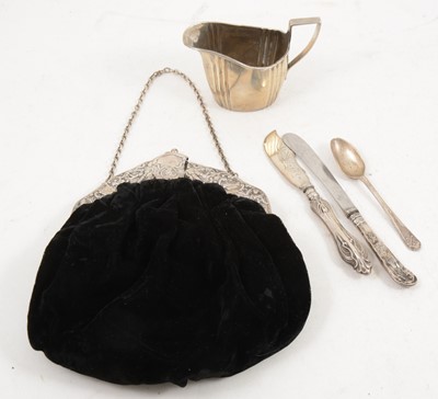 Lot 1213 - A silver cream jug, evening bag (clasp damaged), flatware.