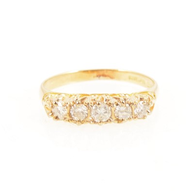 Lot 1250 - A diamond five stone ring.