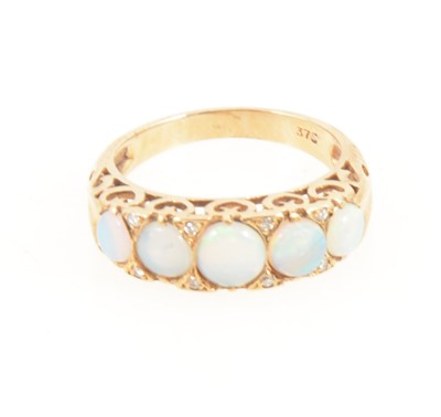 Lot 1273 - An opal half hoop ring.