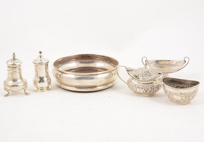 Lot 1178 - A silver bottle coaster and five condiments.