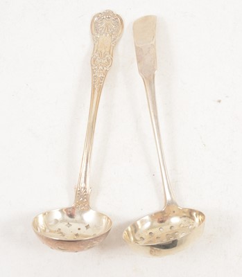 Lot 1206 - Two Scottish silver sugar sifting spoons.