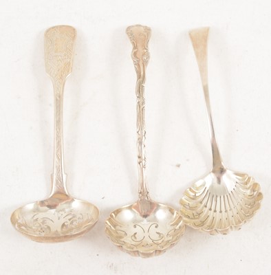 Lot 1205 - Three silver sugar sifting spoons, Birmingham.
