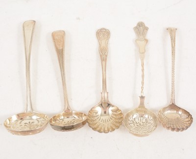Lot 1199 - Five silver sugar sifting spoons, London.