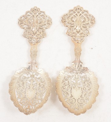 Lot 1211 - A pair of silver spoons with pierced bowls by Goldsmiths & Silversmiths Co Ltd.