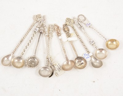 Lot 1198 - Three silver salt spoons with apostle tops and seven others with twisted stems.