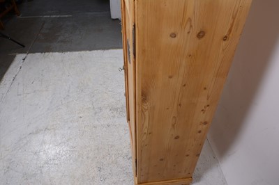 Lot 133 - A pine pantry cupboard