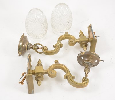 Lot 1072 - A pair of brass wall lights