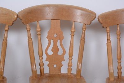 Lot 136 - A pine kitchen table and four chairs