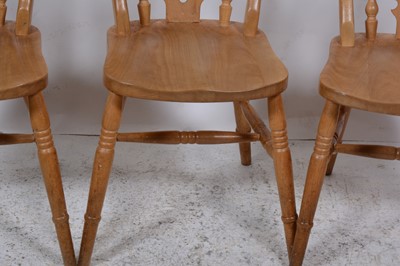 Lot 136 - A pine kitchen table and four chairs