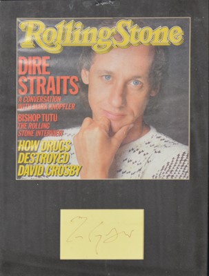Lot 88 - Dire Straits; signature of Mark Knopfler framed and glazed with a cover from Rolling Stones, 34cm by 24cm.