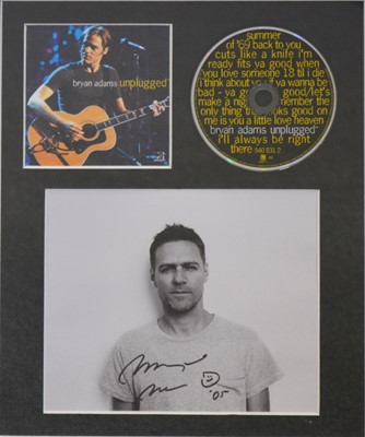 Lot 93 - Bryan Adams; signed photo and CD 'Unplugged', framed and glazed, 32cm x 26cm.