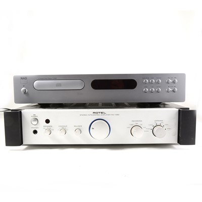 Lot 52 - A Rotel RA-1062 stereo intergrated amplitfier, with cabels and controller, along with a NAD C542 CD player.