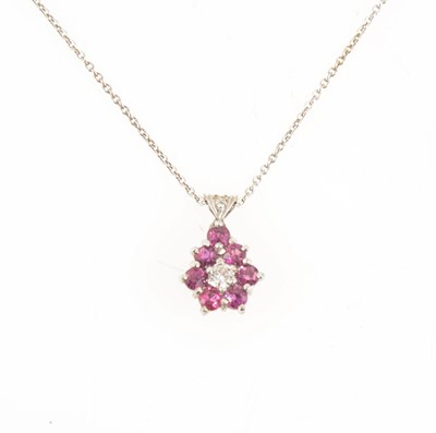 Lot 383A - A ruby and diamond pendant and chain.