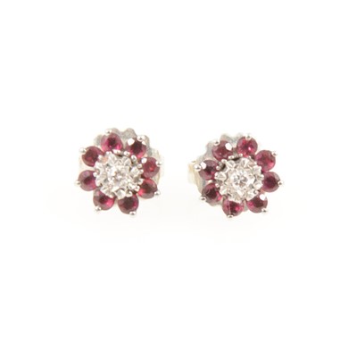 Lot 342 - A pair of ruby and diamond ear studs.