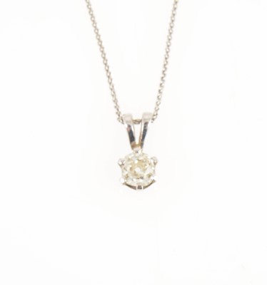 Lot 203 - A diamond solitaire pendant and chain.