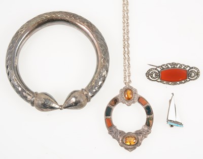 Lot 1348 - Four items of vintage jewellery, a Scottish pendant, marcasite brooch