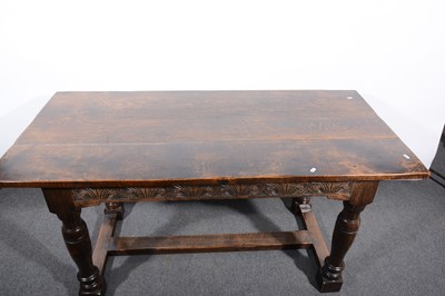 Lot 38 - An oak dining table, rectangular boarded top