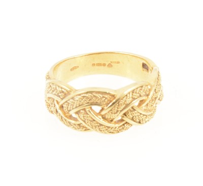 Lot 1272 - An 18 carat yellow gold plaited friendship ring.