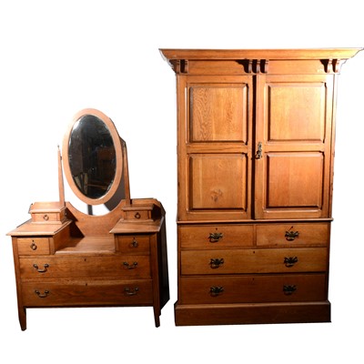 Lot 543 - An Edwardian oak dressing table and a similar laundry cupboard