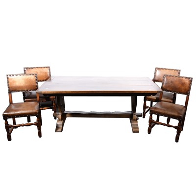 Lot 522 - A restoration style oak dining suite