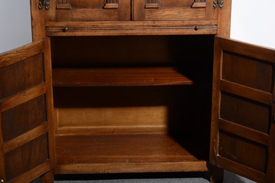 Lot 519 - An oak cocktail cabinet