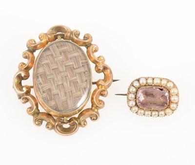 Lot 1294 - A Victorian mourning swivel brooch and a small pearl brooch (centre stone damaged)