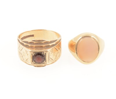 Lot 1280 - Two gold signet rings, garnet and onyx, 9 carat gold.