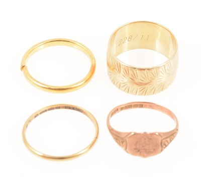 Lot 350A - Three gold wedding bands and a rose gold signet ring.