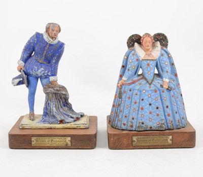Lot 1096 - Houses of Parliament - wartime damage memorabilia, a pair of painted lead figures Sir Walter Raleigh and Queen Elizabeth I on wooden plinths