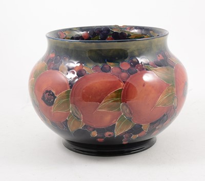 Lot 1053 - A Moorcroft Pottery jardiniere, Pomegranate pattern