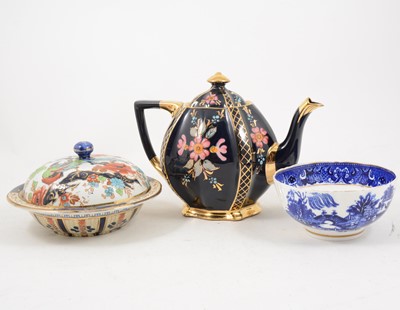 Lot 1058 - A black glazed earthenware four-piece tea service, other teaware