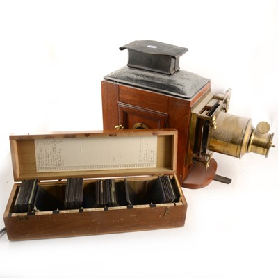 Lot 297 - A mahogany and gilt metal magic lantern, and a large collection of lantern slides