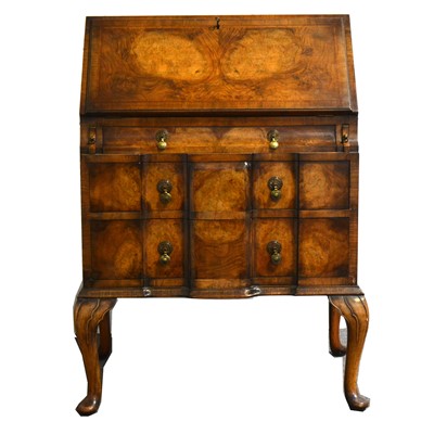 Lot 1564 - A burr walnut bureau in the Georgian style