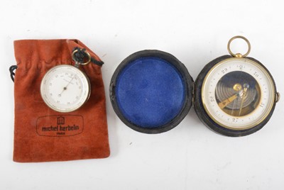 Lot 303 - A brass cased travel aneroid barometer, (cased)