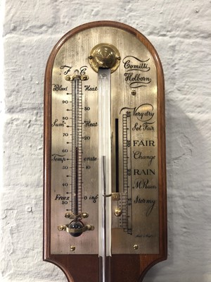 Lot 633 - A reproduction stick barometer