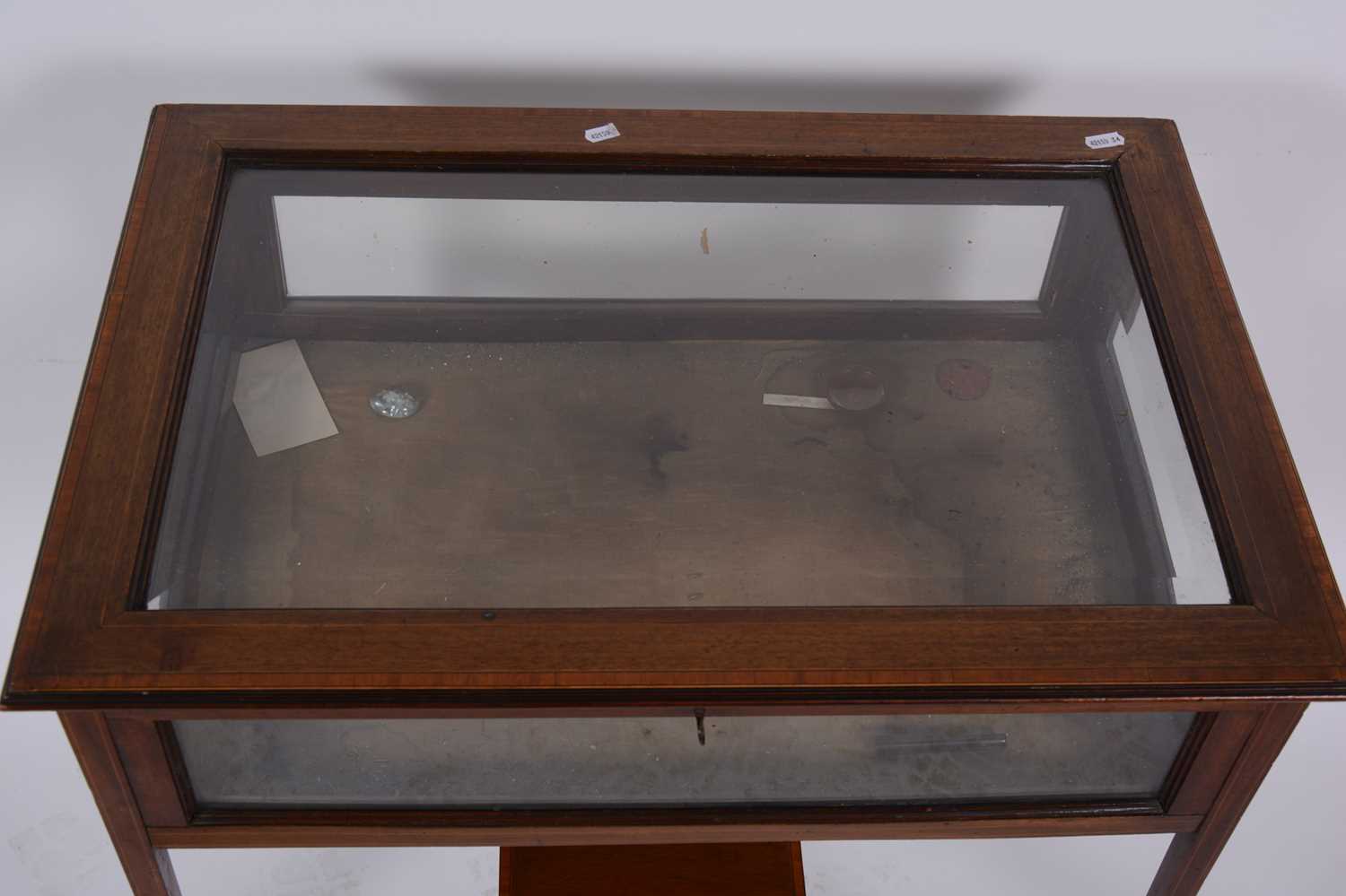 Lot 1555 An Edwardian glasstop display table