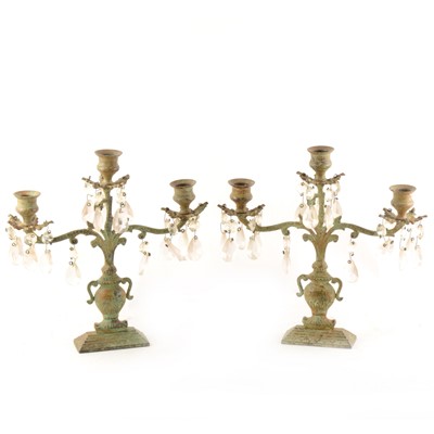 Lot 201 - A pair of contemporary patinated metal three-light candelabra